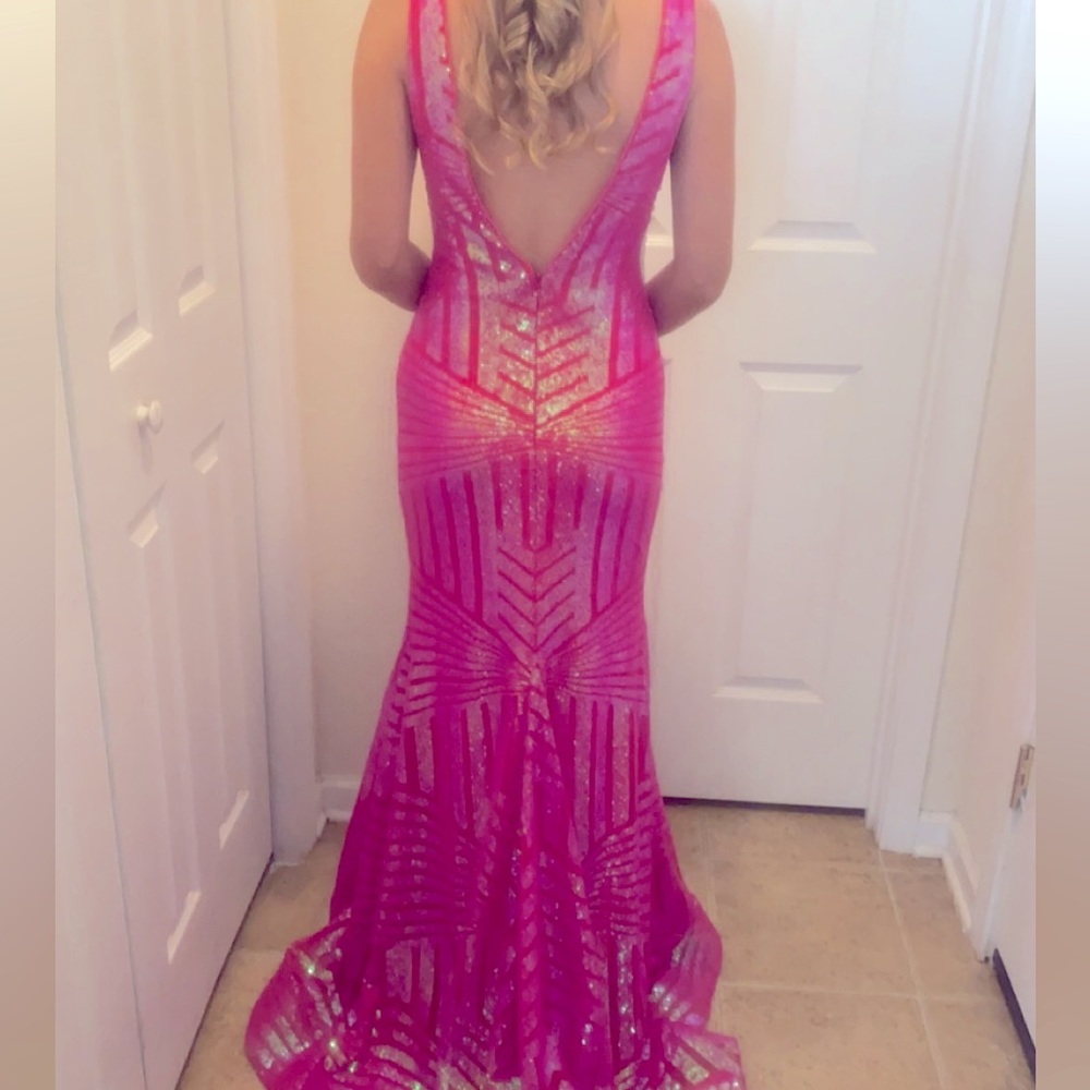 Size 2 Evening gown. Only worn one time. Never had any alterations done.